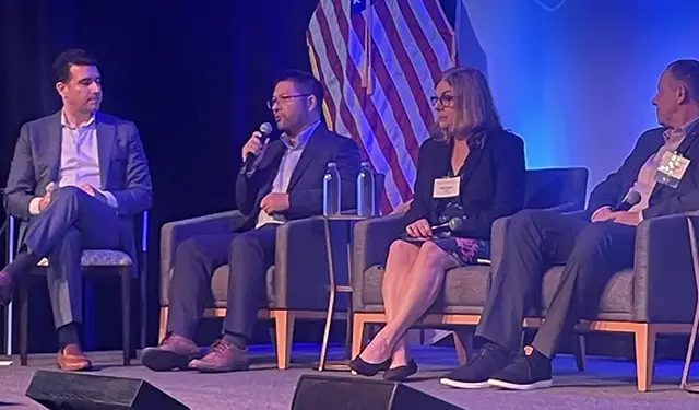 Hebin Li, second from left, speaks at a Quantum Beach 2025 panel discussion.